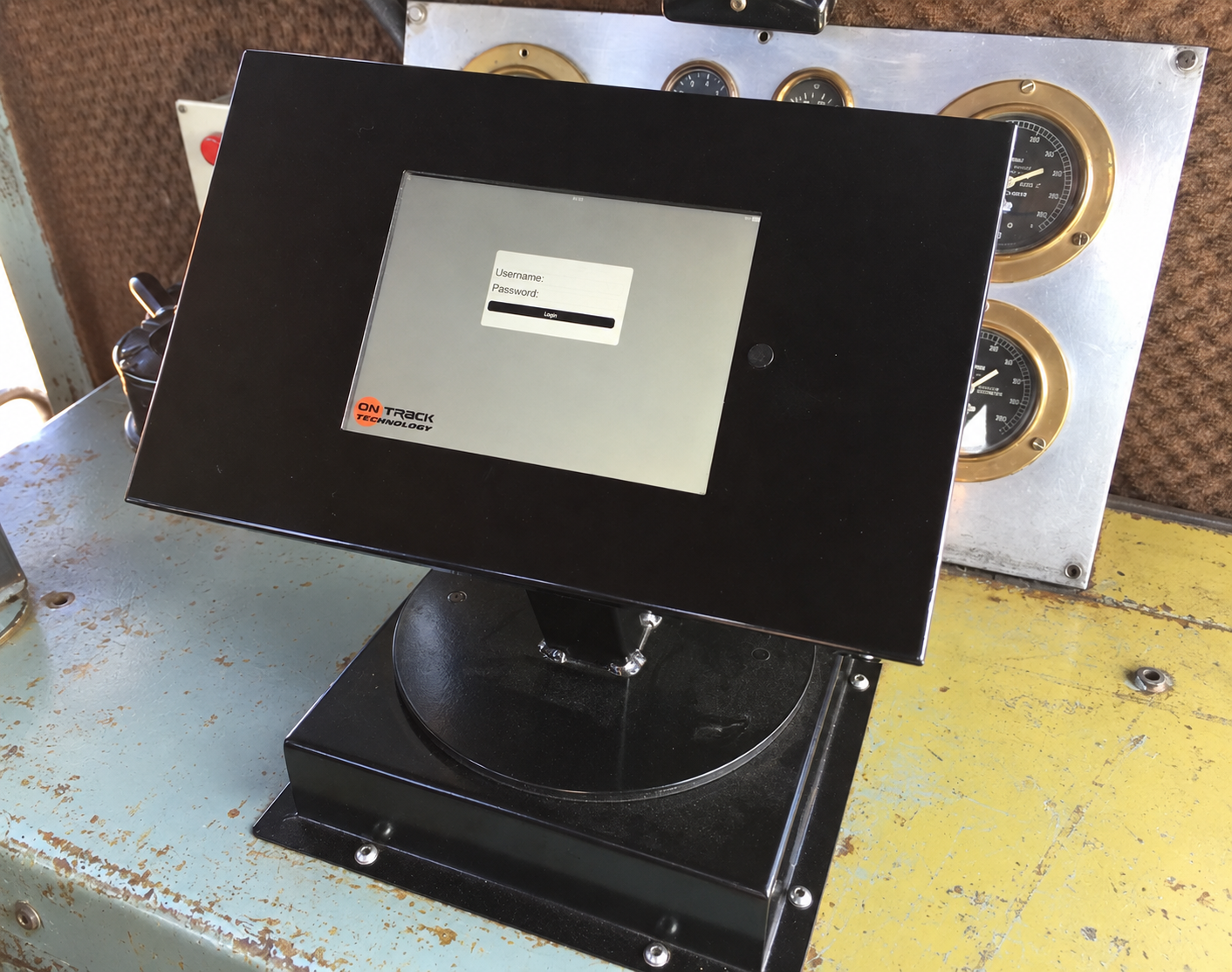 Dynatrack head unit mounted in front of locomotive cab instruments.